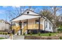Renovated cottage with a stylish front porch and updated landscaping at 1097 Hubbard Sw St, Atlanta, GA 30310