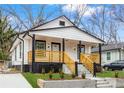 Newly renovated home with a modern farmhouse exterior and welcoming front porch at 1097 Hubbard Sw St, Atlanta, GA 30310