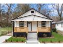 Newly constructed home with a modern exterior and a welcoming front porch at 1097 Hubbard Sw St, Atlanta, GA 30310