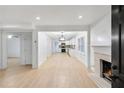 Bright living room with hardwood floors, fireplace, and open concept floor plan at 1967 Browns Mill Se Rd, Atlanta, GA 30315