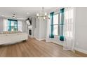 Bright dining room with hardwood floors and a modern chandelier at 5313 Hearthstone St, Stone Mountain, GA 30083