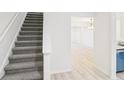 Carpeted staircase leads to the upper level, with a glimpse of the dining area at 3820 Waldrop Ln, Decatur, GA 30034