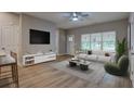 Living room with wood floors and plenty of natural light at 4230 Moore Rd, Conley, GA 30288