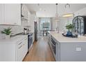 Modern kitchen with white cabinets, stainless steel appliances and an island at 127 Stein Steel St # 12, Atlanta, GA 30316