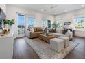 Spacious living room with hardwood floors and access to a balcony at 127 Stein Steel St # 12, Atlanta, GA 30316