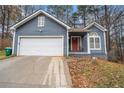 Front exterior of a two-story home with a one-car garage and driveway at 2291 Wilkins Ct, Decatur, GA 30035