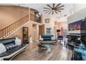 Spacious living room with high ceilings, wood-look floors, and a fireplace at 2291 Wilkins Ct, Decatur, GA 30035