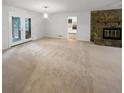 Spacious living room with neutral carpeting and lots of natural light at 120 Black Rock Ct, Fayetteville, GA 30214