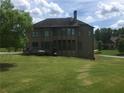Backyard with a deck and a view of the back of the home at 1880 Hays Farm Walk, Marietta, GA 30064