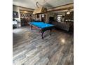 Game room featuring a pool table and wood-look floors at 1824 Smith Store Rd, Covington, GA 30016