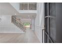 Bright and spacious entryway with hardwood floors, a staircase, and an open floor plan at 2626 Sardis Way, Buford, GA 30519