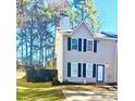 Two-story home with a fenced yard and driveway at 5580 Windwood Rd, Atlanta, GA 30349