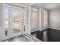 Bright entryway with hardwood floors, a glass door and access to other rooms at 2612 Grove Park Ln, Conyers, GA 30094