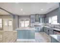 Island kitchen with marble countertops and gray cabinets at 2371 Shadow Pines Ct, Duluth, GA 30096