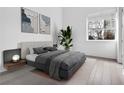 Spacious bedroom with hardwood floors and large window at 775 Juniper Ne St # 619, Atlanta, GA 30308
