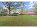 Expansive backyard with a separate outbuilding at 7865 Nesbit Ferry Rd, Sandy Springs, GA 30350