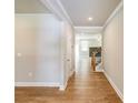 Hallway leading to the living room and staircase at 7640 Homer Dr, Cumming, GA 30028