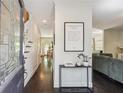 Bright entryway with dark hardwood floors and a large glass front door at 1900 Harper Nw Rd, Atlanta, GA 30318