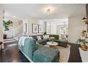 Open living room featuring a large sectional sofa and a view into the dining area at 1900 Harper Nw Rd, Atlanta, GA 30318