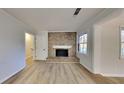 Living room with fireplace and hardwood floors at 5768 Albans Cir, Lithonia, GA 30058