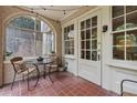 Relaxing screened porch with tiled floor and outdoor seating at 2222 Peachtree Nw Rd # C6, Atlanta, GA 30309