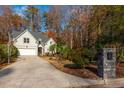 Two-story house with driveway, landscaping and basketball goal at 1472 Lachona Ct, Atlanta, GA 30329