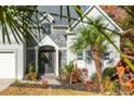 Front entrance with decorative door, stonework, and lush landscaping at 1472 Lachona Ct, Atlanta, GA 30329