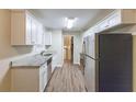 Renovated kitchen with granite countertops and stainless steel appliances at 2761 Whisper Ct, Douglasville, GA 30135