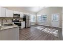 Modern kitchen with white cabinets, stainless steel appliances, and granite countertops at 2755 Sherlock Dr, Decatur, GA 30034