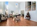 Spacious living room with hardwood floors and high ceilings at 1142 Preserve Park Dr, Loganville, GA 30052