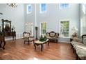 Bright living room with hardwood floors and high ceilings at 1142 Preserve Park Dr, Loganville, GA 30052