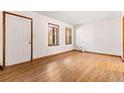 Simple living room with hardwood floors and neutral walls at 1762 Hunting Creek Se Ln, Conyers, GA 30013