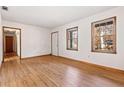 Spacious living room with hardwood floors and hallway view at 1762 Hunting Creek Se Ln, Conyers, GA 30013