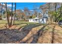 White home with large yard and trees at 1766 Blossom Ln, Austell, GA 30168