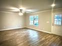 Bright living room with ample natural light and wood-look floors at 3 Forkwood Cir, Hiram, GA 30141