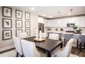 Bright dining area with dark wood table and six upholstered chairs at 3351 Orwell Way # 2301, Cumming, GA 30041