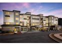 Luxury apartment building exterior at dusk at 3351 Orwell Way # 2301, Cumming, GA 30041