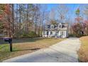 A two-story home with a driveway and a front yard at 2638 Foxglove Sw Dr, Marietta, GA 30064