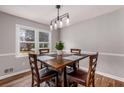 Dining room with hardwood floors and modern light fixture at 3090 Karen Ne Ln, Marietta, GA 30062