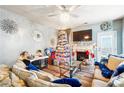 Spacious living room with a fireplace and a large Christmas tree at 5901 Seabright Ln, Atlanta, GA 30349