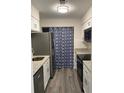 Modern kitchen with white cabinets, stainless steel appliances, and granite countertops at 1166 Booth Sw Rd # 610, Marietta, GA 30008