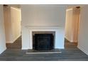 Living room with fireplace flanked by hallways at 1166 Booth Sw Rd # 610, Marietta, GA 30008