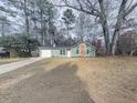 Newly renovated house with a stone facade and attached garage at 851 Forest Path, Stone Mountain, GA 30088