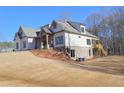 Two-story home with white siding, gray roof and deck at 325 Mont Harmony Sw Rd, Powder Springs, GA 30127