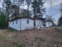 White single-story home exterior with landscaping and trees at 4193 Port Chester Way, Decatur, GA 30034