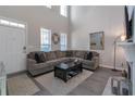 Living room featuring a sectional sofa and hardwood floors at 70 Oak Green Dr, Lawrenceville, GA 30044