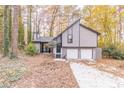 Gray two-story house with a two-car garage and landscaped yard at 3814 Whaley Ct, Snellville, GA 30039