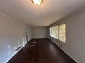 Spacious living room featuring hardwood floors and large windows at 1657 Mcclelland Ave, Atlanta, GA 30344