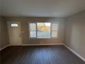 Bright living room with hardwood floors and large windows at 1959 Bandera Dr, Decatur, GA 30032