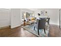 Cozy living room with hardwood floors, fireplace and large windows at 1951 Cummings Sw Dr, Atlanta, GA 30311